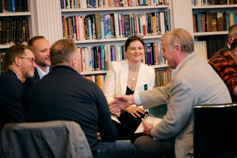 A group of senior leaders in conversation at The Emergence
